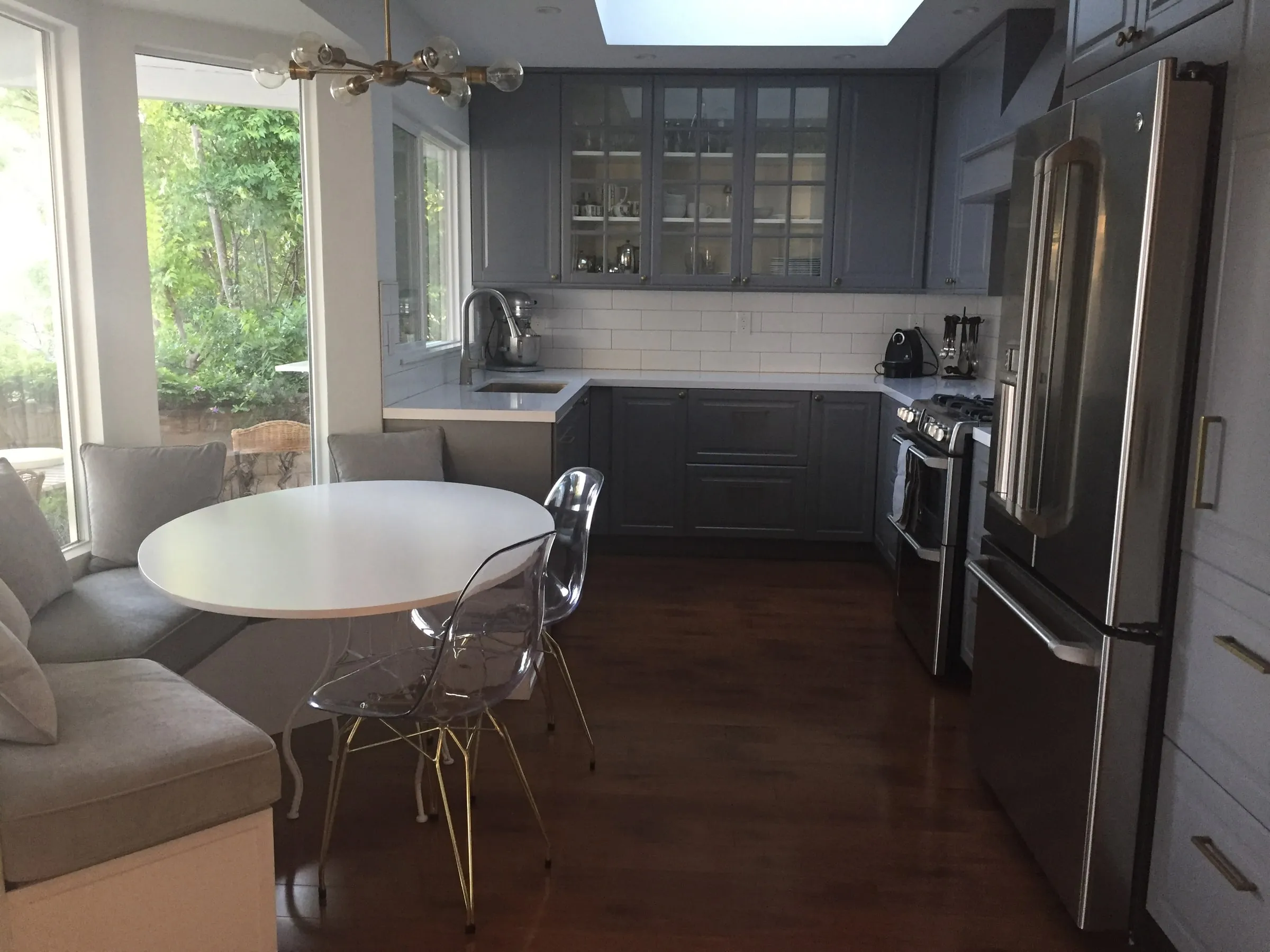 Detail of the finished kitchen looking toward the banquette and window bay.